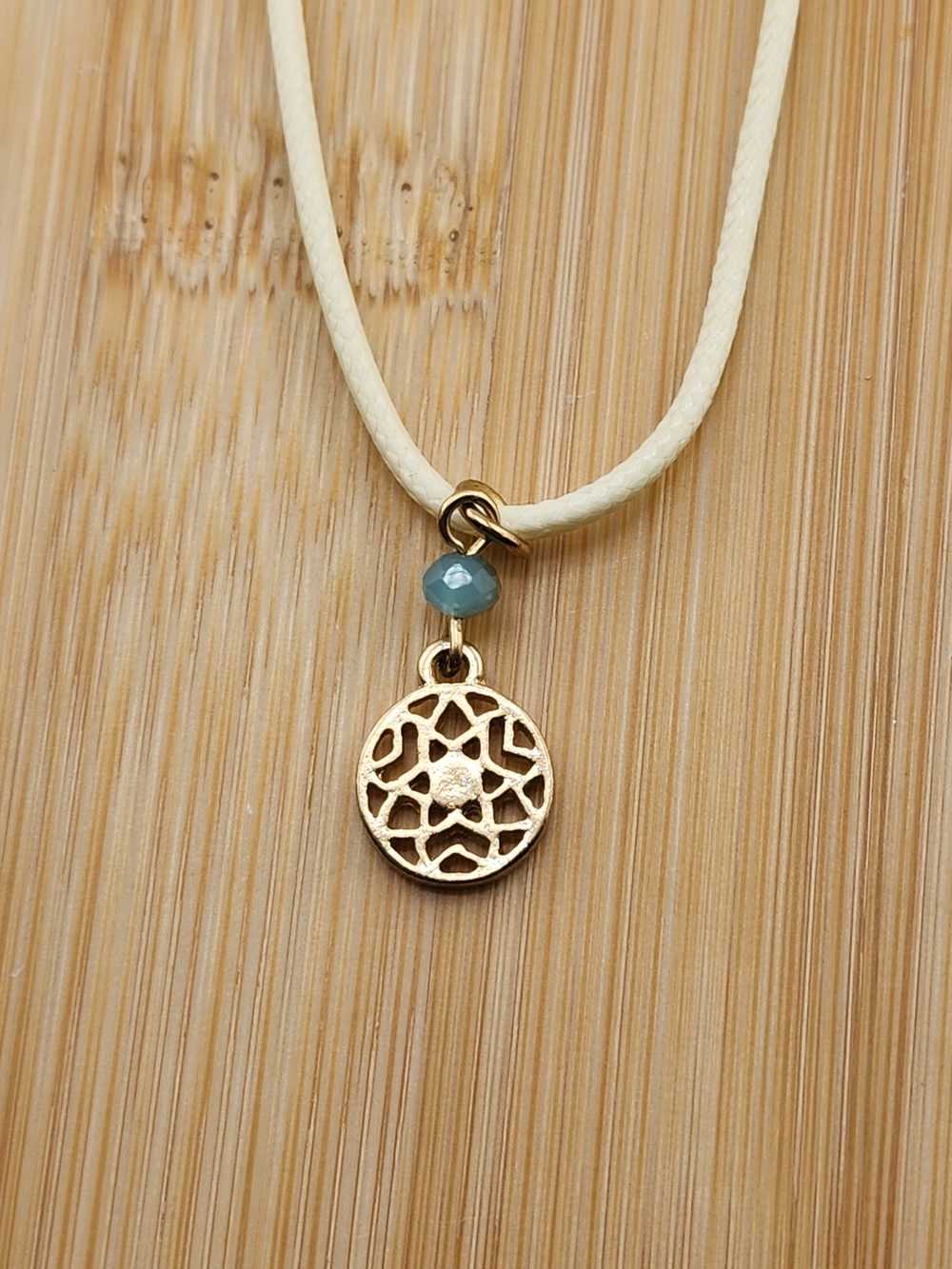 18in Adjustable Gold Tone Filigree Necklace with Cream Cord and Blue Bead